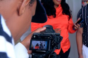 An image of a man taking a phot0graph
