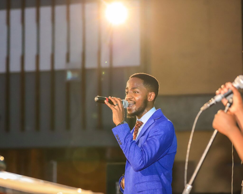 A man singing with a microphone